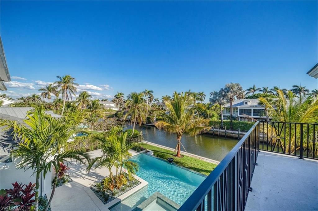 508 16th Avenue South Naples, FL 34102 - Photo 31 of 43 Patio view of pool and water view to the Southeast.