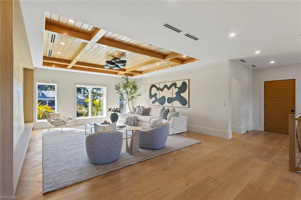 508 16th Avenue South Naples, FL 34102 - Photo 35 of 50 Living room featuring a wooden ceiling with exposed beams, light wood finished floors, coffered ceiling, and recessed lighting