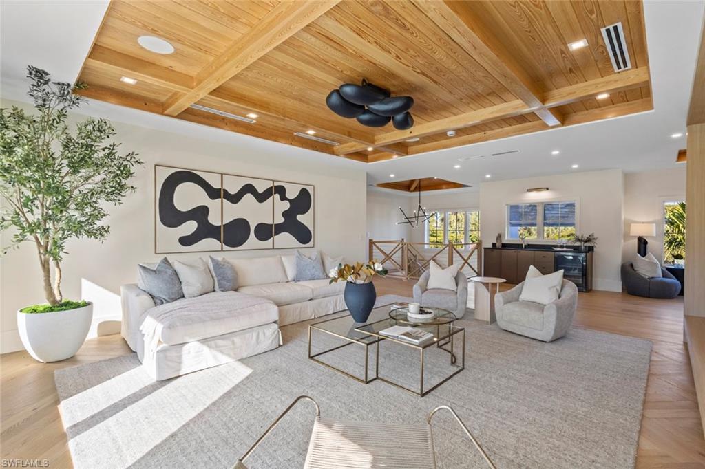 508 16th Avenue South Naples, FL 34102 - Photo 37 of 50 Living area featuring a wood ceiling with exposed beams, parquet floors, and recessed lighting