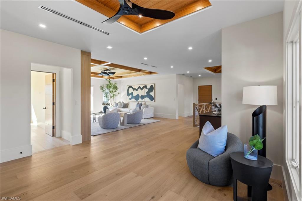 508 16th Avenue South Naples, FL 34102 - Photo 39 of 50 Living area featuring wooden ceiling, ceiling fan, recessed lighting, light wood-type flooring, and a raised ceiling