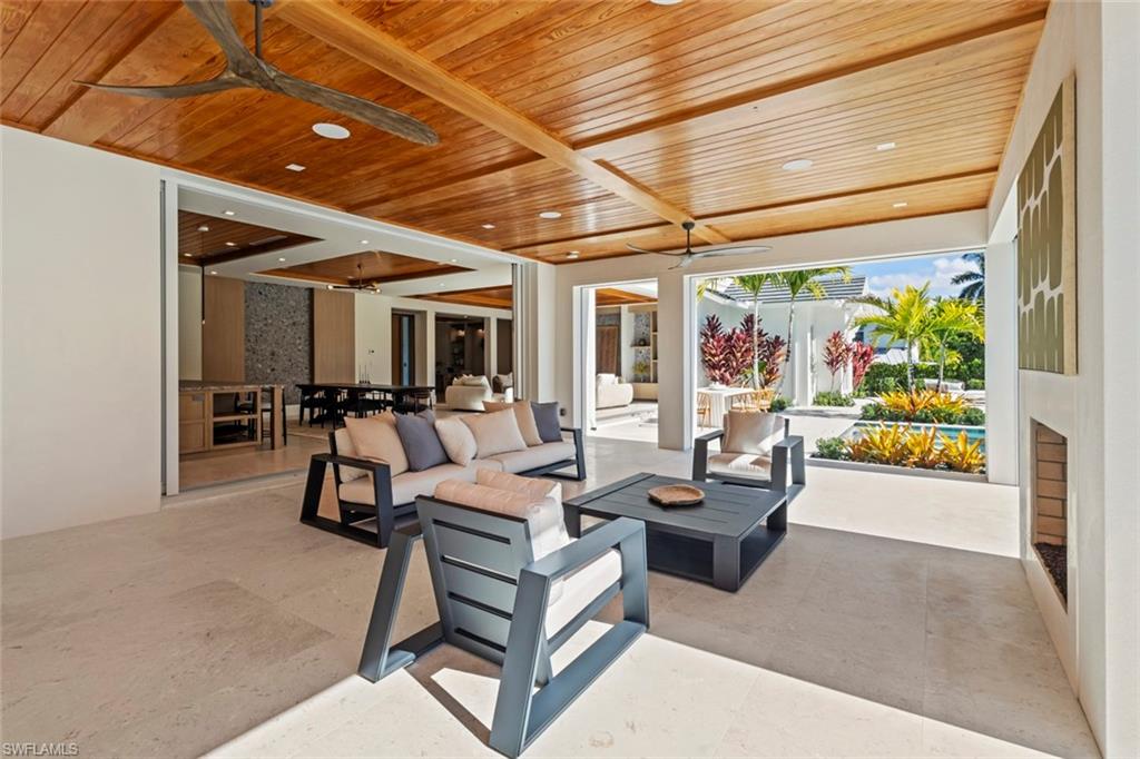 508 16th Avenue South Naples, FL 34102 - Photo 42 of 50 View of patio / terrace featuring a ceiling fan, outdoor dining area, and outdoor lounge area