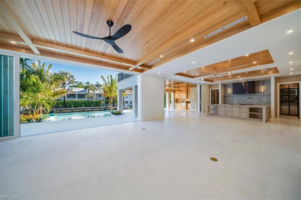 508 16th Avenue South Naples, FL 34102 - Photo 8 of 43 Living room to pool area.