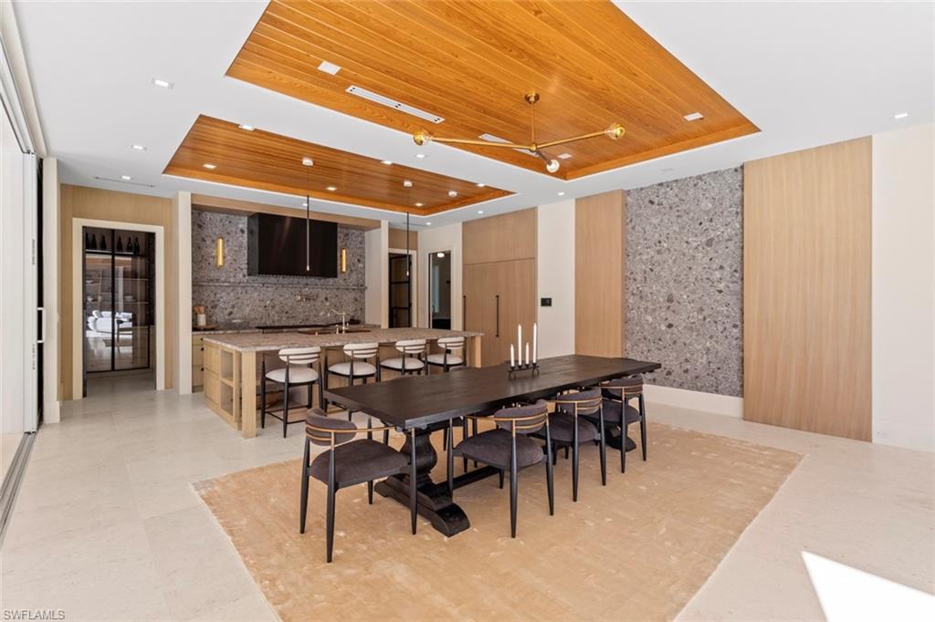 508 16th Avenue South Naples, FL 34102 - Photo 9 of 50 Dining space featuring a tray ceiling and wood ceiling