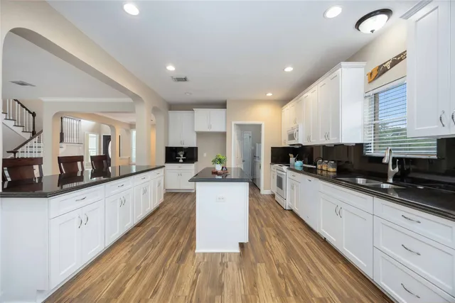 a view of a house with a yard and garage