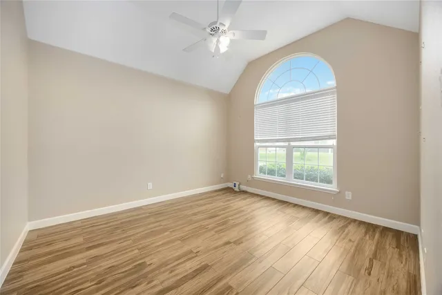a view of a house with backyard and porch
