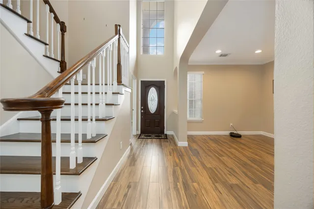 a bathroom with a tub sink shower and mirror