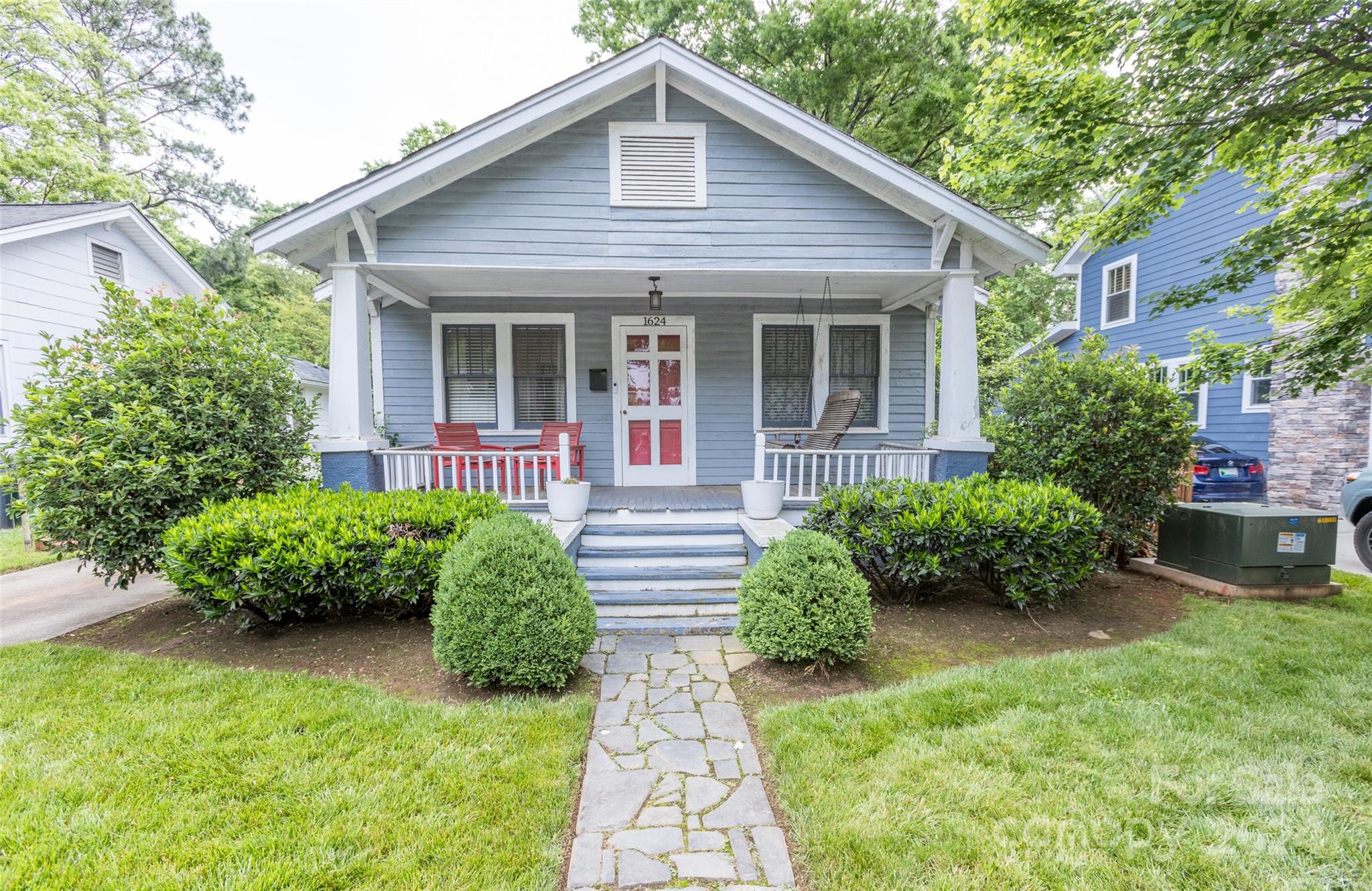 a front view of a house with garden