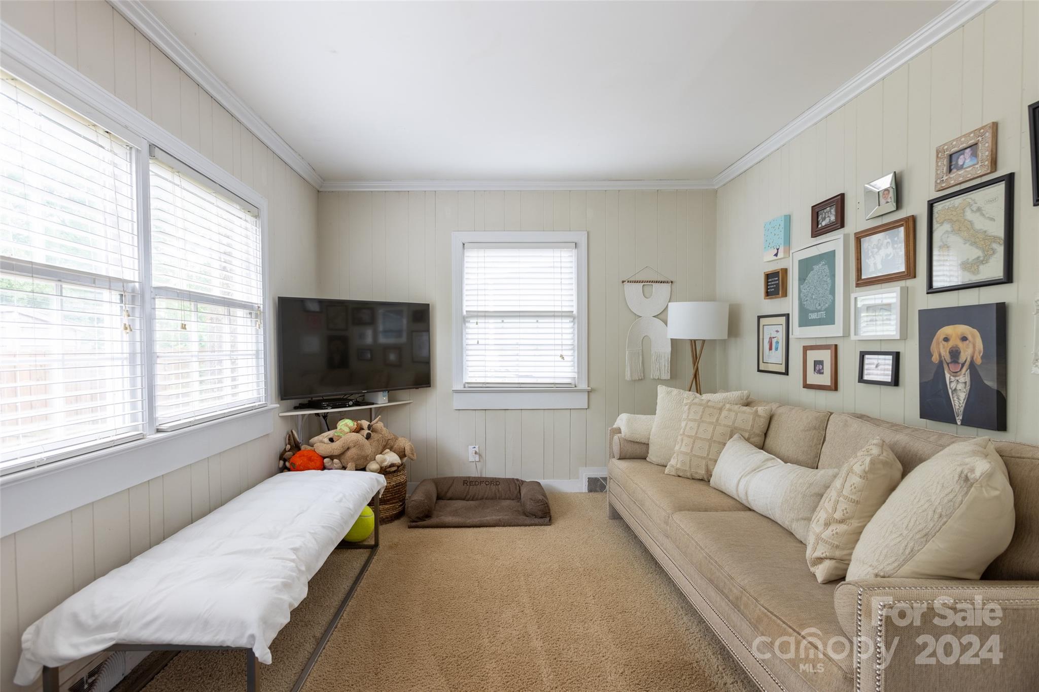1624 Club Road Charlotte, NC 28205 - Photo 14 of 23 a bedroom with furniture and a flat screen tv