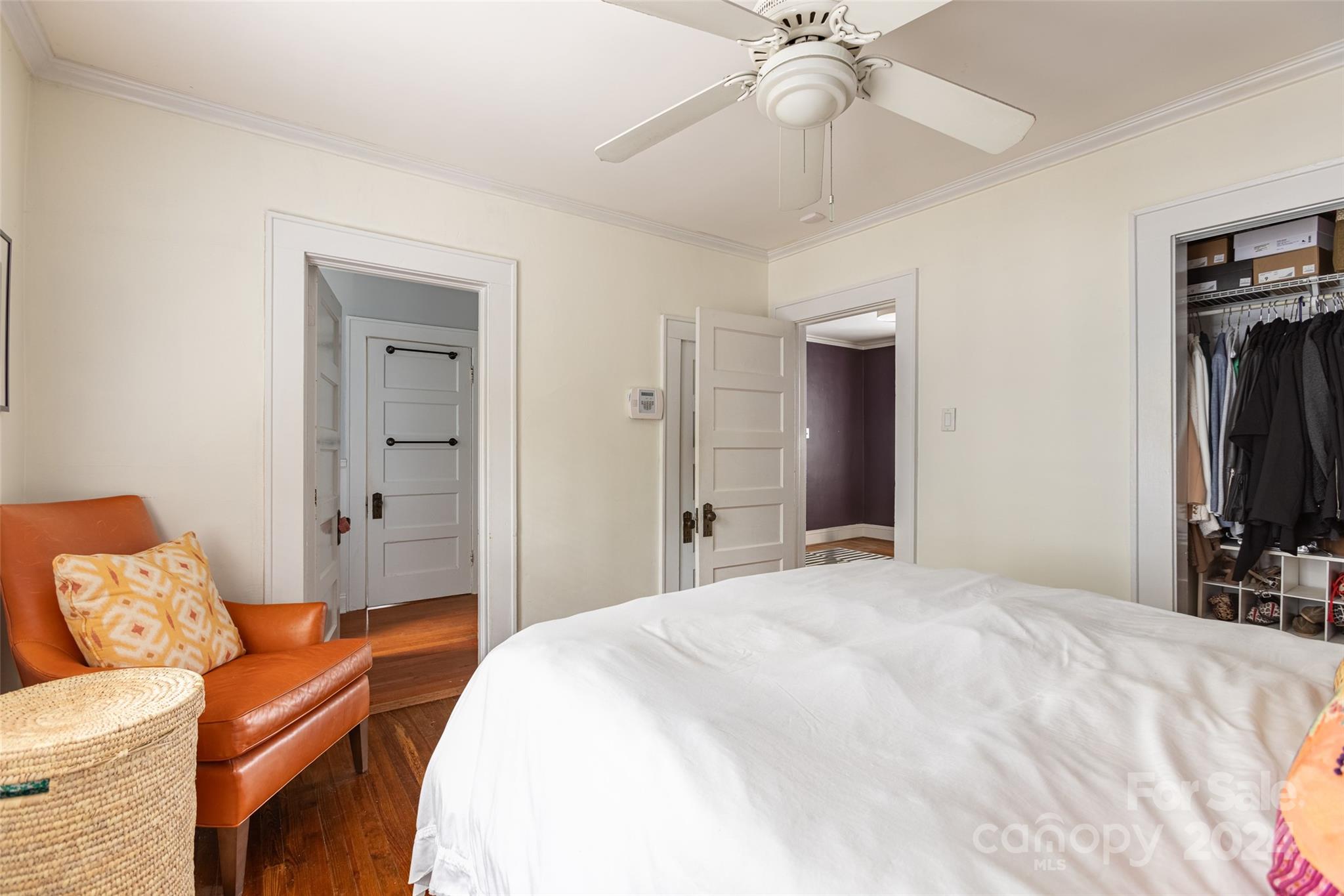 1624 Club Road Charlotte, NC 28205 - Photo 16 of 23 a bedroom with a bed and a chandelier