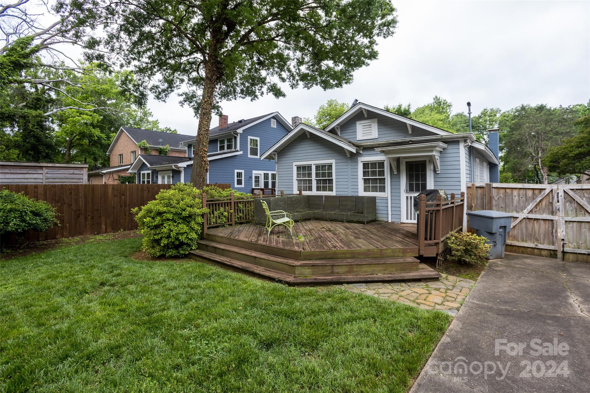 1624 Club Road Charlotte, NC 28205 - Photo 20 of 23 a view of a house with a yard and sitting area