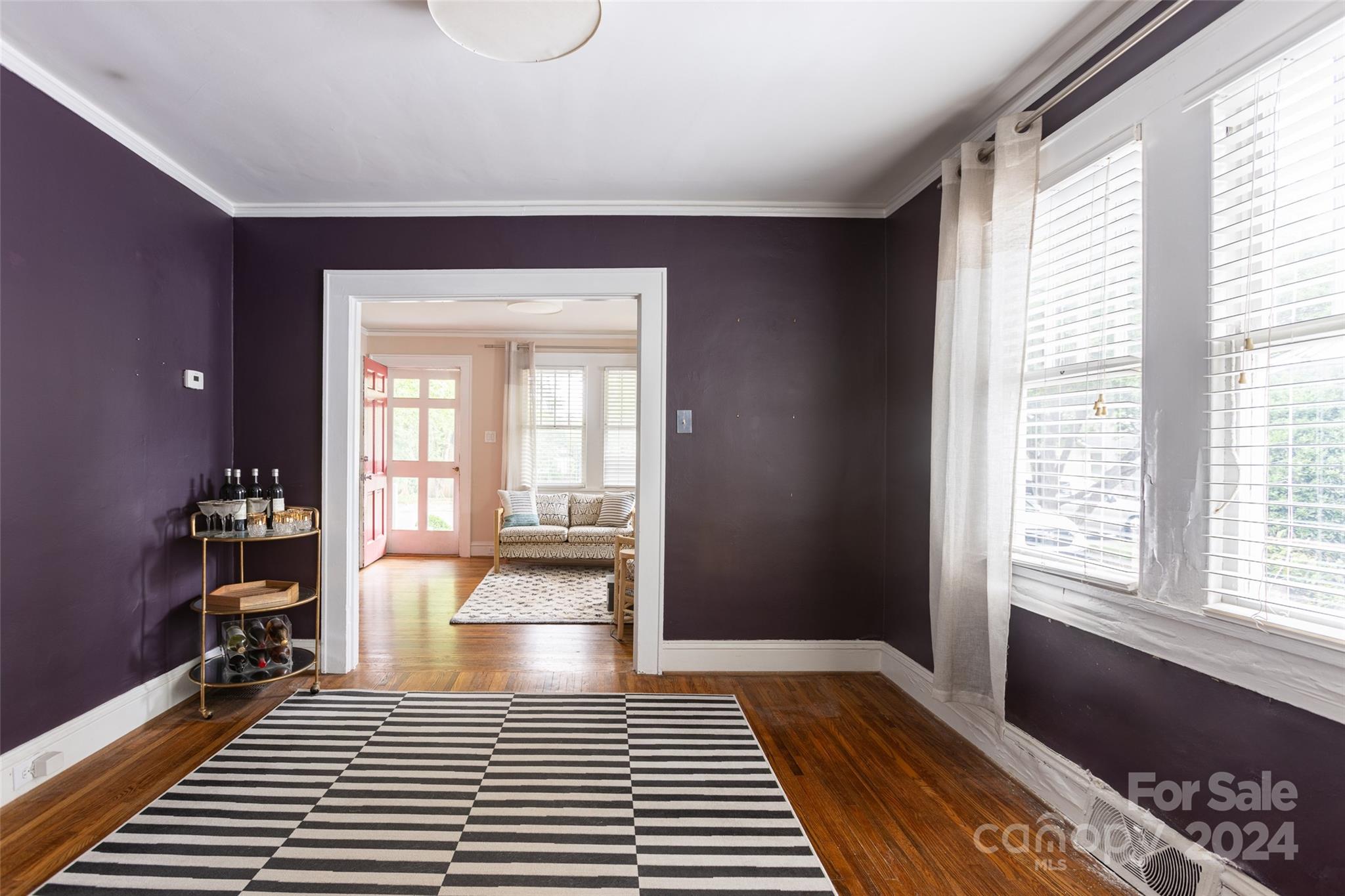 1624 Club Road Charlotte, NC 28205 - Photo 6 of 23 a view of a room with wooden floor and a rug
