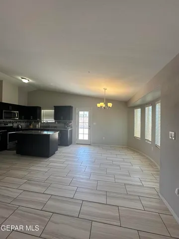 a kitchen with stainless steel appliances granite countertop a sink counter space cabinets and stainless steel appliances