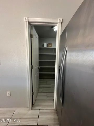 a view of a glass door with a yard from a balcony