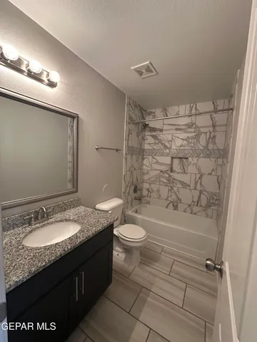 a bathroom with a sink a mirror and a shower