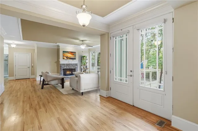 a spacious bedroom with a bed and a chandelier