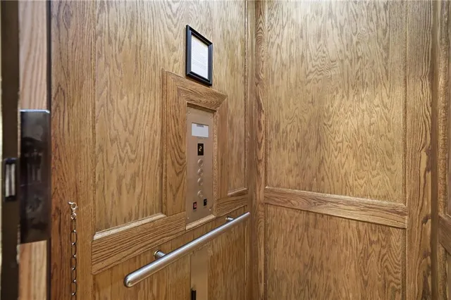 a spacious bathroom with a granite countertop sink and a mirror