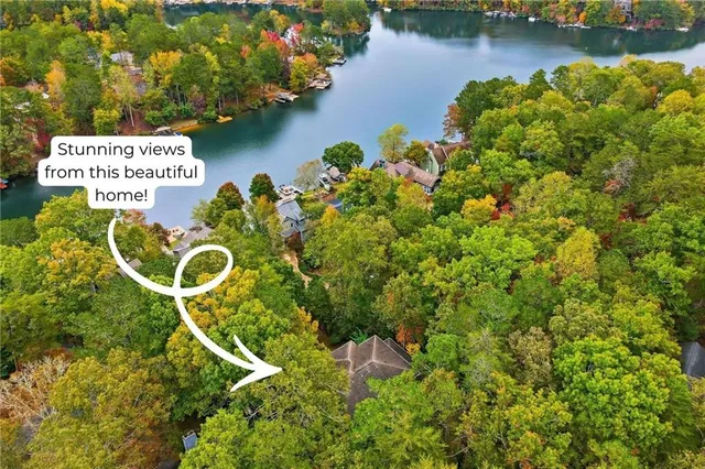 a dining room with furniture a chandelier and wooden floor