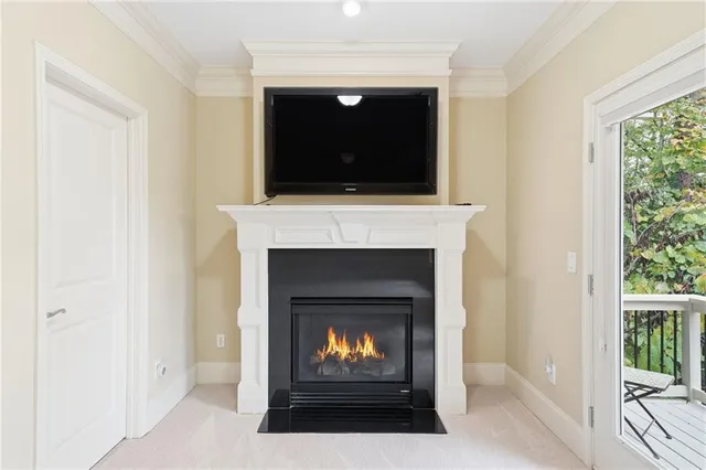 a bathroom with a granite countertop sink a toilet a mirror a bathtub and shower