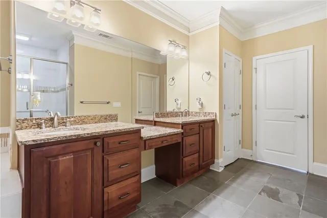 a bedroom with a large bed and a flat screen tv