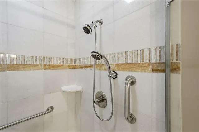 a bathroom with a granite countertop toilet a sink and a bathtub