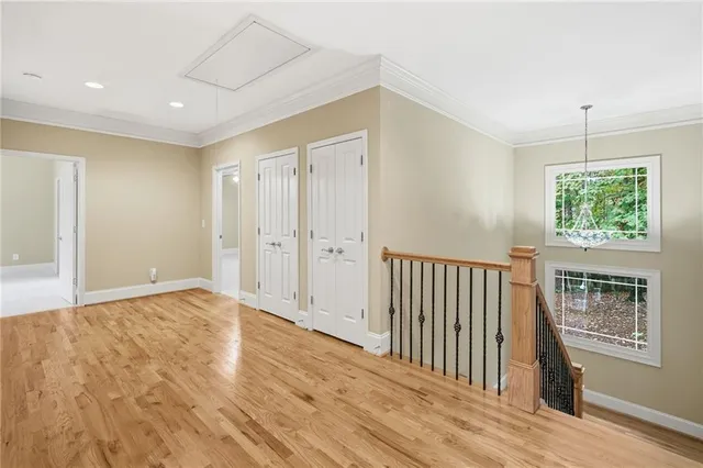 a view of walk in closet with empty racks