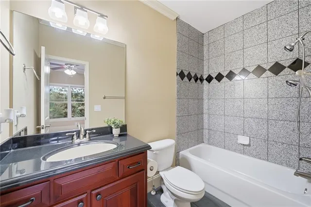 a kitchen with granite countertop white cabinets stainless steel appliances and sink