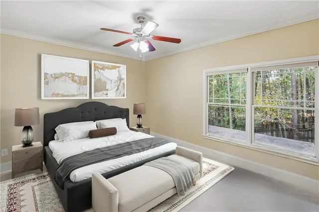 a living room with furniture and a dining table