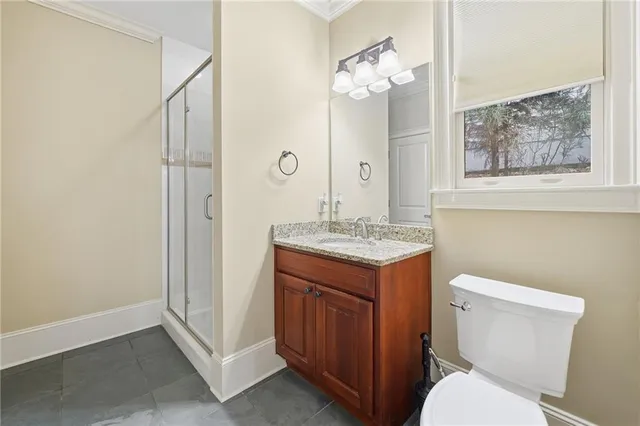 a backyard of a house with barbeque oven table and chairs