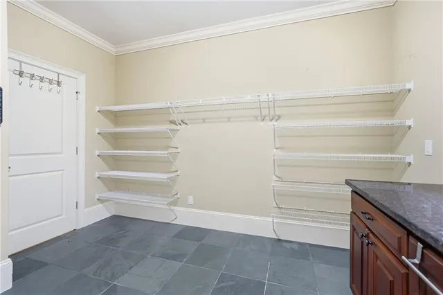 an aerial view of a houses with a lake view