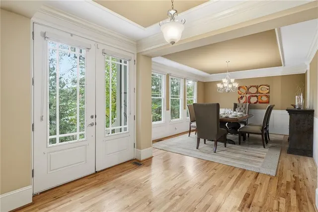 a kitchen with granite countertop a sink stainless steel appliances and cabinets