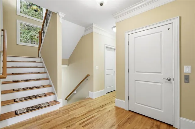 an aerial view of residential houses with outdoor space and lake view