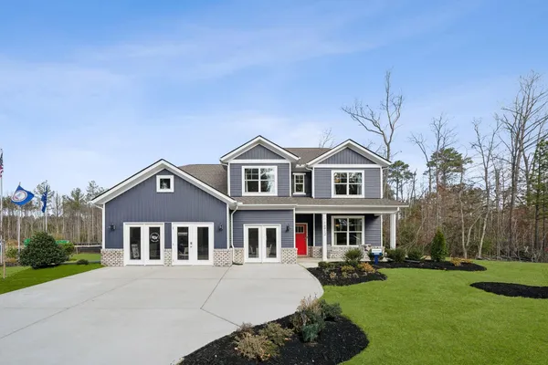 front view of a house with a yard