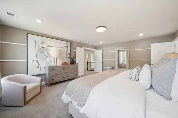 a bedroom with bed and window