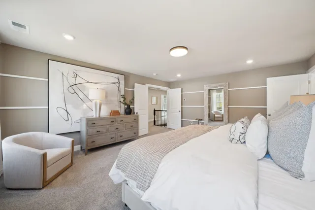 a bedroom with bed and window