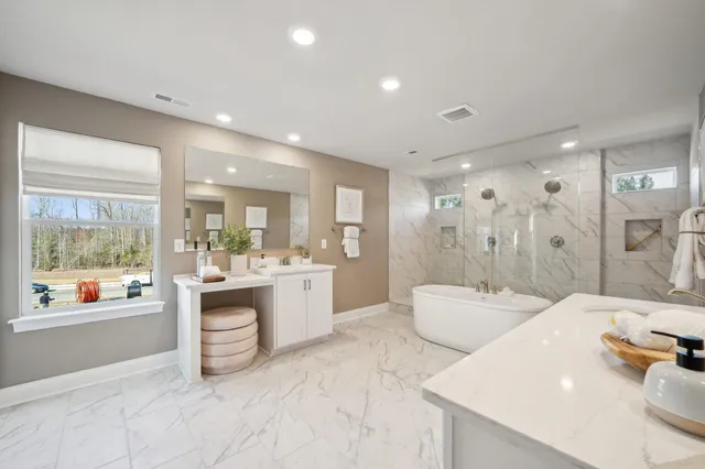 a large bathroom with a double vanity sink a large mirror and shower