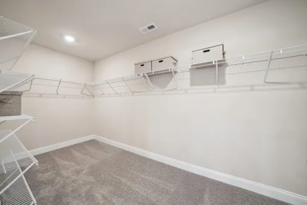 a view of a room with racks on the wall