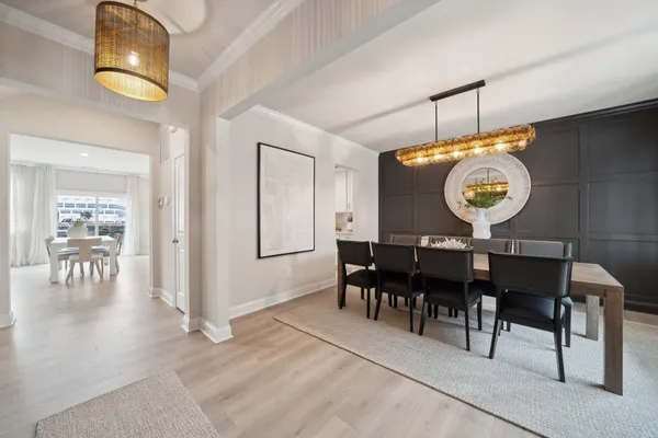 a view of a dining area with furniture and chandelier