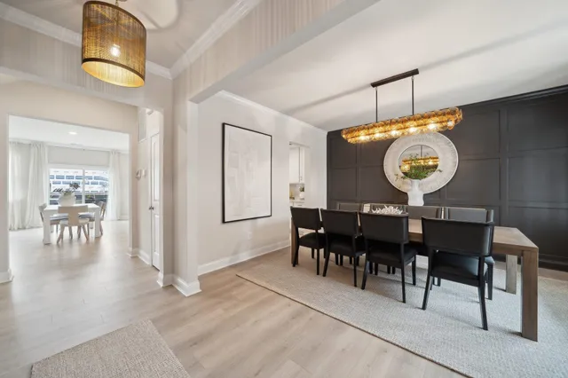 a view of a dining area with furniture and chandelier