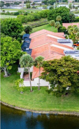 20020 Rima Circle Boca Raton, FL 33434 - Photo 16 of 26 a view of a backyard with plants and lake view