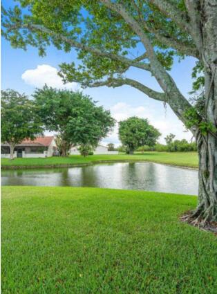 20020 Rima Circle Boca Raton, FL 33434 - Photo 17 of 26 a view of a lake with houses in the back