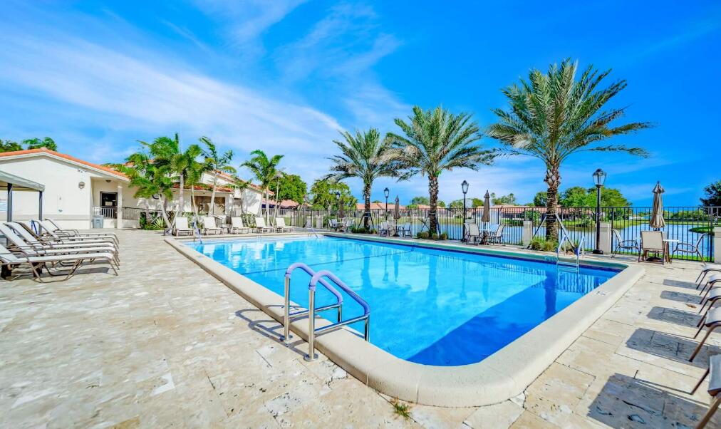 20020 Rima Circle Boca Raton, FL 33434 - Photo 5 of 26 a view of swimming pool with outdoor seating and plants