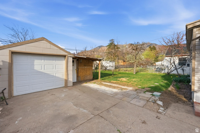 708 9th Street Ogden, UT 84404 - Photo 3 of 17 Garage with driveway and a mountain view