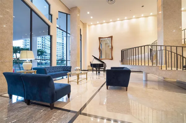 a living room with furniture and a large window
