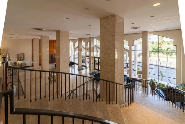 a view of a living room and balcony