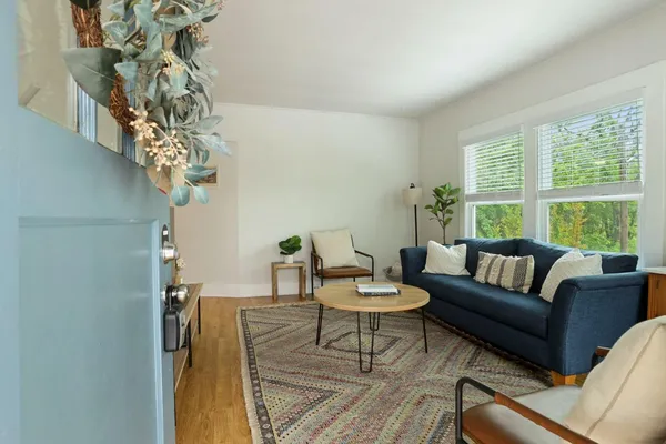 a living room with furniture and a large window