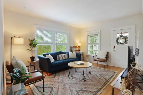 a living room with furniture and a table