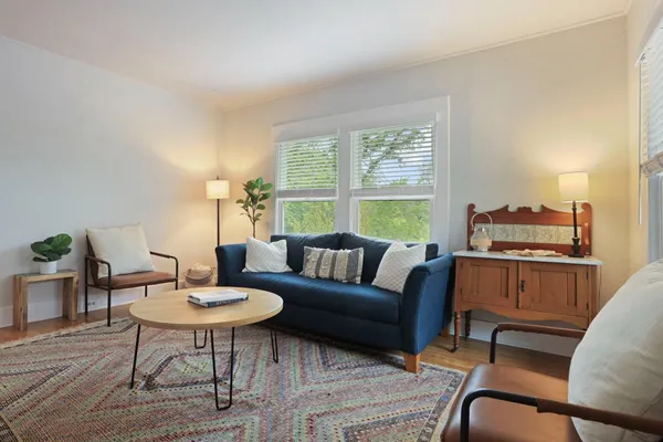 a view of a dining room with furniture and window