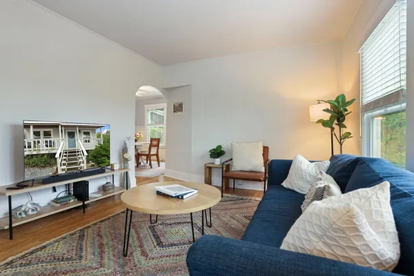 a view of a dining room with furniture window and wooden floor