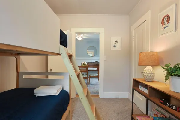 a bedroom with a large bed and a window