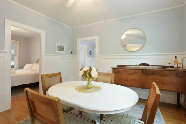 a bedroom with a large bed and a window